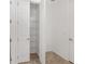 Walk-in pantry with wire shelving; neutral tile flooring at 9350 Sw 91St Court Rd, Ocala, FL 34481
