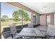 Relaxing screened porch with seating area and golf course view at 9350 Sw 91St Court Rd, Ocala, FL 34481