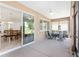 Screened porch with access to dining room and seating area at 9350 Sw 91St Court Rd, Ocala, FL 34481
