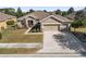 Single-Gathering home with two-car garage and landscaped yard at 9826 Sw 63Rd Loop, Ocala, FL 34481