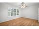 Bedroom with large window and wood flooring at 9826 Sw 63Rd Loop, Ocala, FL 34481