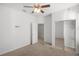 Spacious bedroom with mirrored closet doors and carpet at 9826 Sw 63Rd Loop, Ocala, FL 34481