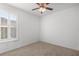 Bright bedroom featuring wood flooring and window shutters at 9826 Sw 63Rd Loop, Ocala, FL 34481