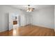 Spacious bedroom with wood floors and access to bathroom at 9826 Sw 63Rd Loop, Ocala, FL 34481