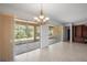Dining room with chandelier and sliding doors to patio at 9826 Sw 63Rd Loop, Ocala, FL 34481