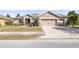 Single-story home with two-car garage and well-maintained landscaping at 9826 Sw 63Rd Loop, Ocala, FL 34481