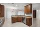 Kitchen with island, stainless steel appliances, and wood cabinets at 9826 Sw 63Rd Loop, Ocala, FL 34481