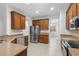 Kitchen with stainless steel appliances and wood cabinets at 9826 Sw 63Rd Loop, Ocala, FL 34481