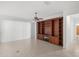 Living room with built-in shelving and fireplace at 9826 Sw 63Rd Loop, Ocala, FL 34481