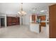 Bright living room featuring built-in shelving and fireplace at 9826 Sw 63Rd Loop, Ocala, FL 34481