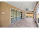 Screened-in porch with tile flooring and ceiling fan at 9826 Sw 63Rd Loop, Ocala, FL 34481