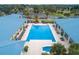 Resort-style pool with lounge chairs and adjacent building at 10816 Sw 83Rd Ave, Ocala, FL 34481