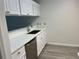 Bright kitchen featuring white cabinets and modern countertops at 10842 Se 50Th Ave # 1, Belleview, FL 34420