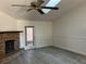 Living room with vaulted ceiling, skylight and fireplace at 10842 Se 50Th Ave # 1, Belleview, FL 34420