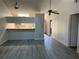 Open living room and kitchen with a breakfast bar at 10842 Se 50Th Ave # 1, Belleview, FL 34420