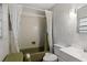 Bathroom with olive green tub, shower and white vanity at 17411 Se 18Th St, Silver Springs, FL 34488