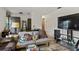 Cozy living room with couches, a large TV, and a coffee table at 17411 Se 18Th St, Silver Springs, FL 34488