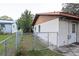 Side yard with chain link fence and access gate at 17411 Se 18Th St, Silver Springs, FL 34488