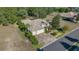 Bird's eye view of a house with a three-car garage and nicely landscaped yard at 17819 Sw 61St Lane Rd, Dunnellon, FL 34432