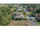 An aerial view showcasing a house in a neighborhood with lush greenery at 17819 Sw 61St Lane Rd, Dunnellon, FL 34432