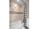 Tiled bathroom with tub and shower, and neutral tones at 17819 Sw 61St Lane Rd, Dunnellon, FL 34432