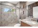 Bathroom with tiled shower, granite vanity and updated fixtures at 17819 Sw 61St Lane Rd, Dunnellon, FL 34432