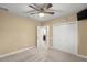 Bedroom with ceiling fan, large closet, and access to bathroom at 17819 Sw 61St Lane Rd, Dunnellon, FL 34432