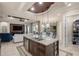 Large kitchen island with seating, double sinks, and storage at 17819 Sw 61St Lane Rd, Dunnellon, FL 34432