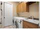 Laundry room with washer, dryer, and cabinets at 17819 Sw 61St Lane Rd, Dunnellon, FL 34432