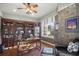 Home office with built-in shelving and hardwood floors at 17819 Sw 61St Lane Rd, Dunnellon, FL 34432