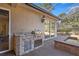 Outdoor kitchen with built-in grill and sink at 17819 Sw 61St Lane Rd, Dunnellon, FL 34432