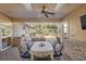 Outdoor dining area with kitchen and pool view at 17819 Sw 61St Lane Rd, Dunnellon, FL 34432