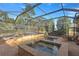 Spacious pool and spa with covered patio and lush landscaping at 17819 Sw 61St Lane Rd, Dunnellon, FL 34432