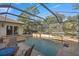 Expansive pool and spa with covered patio and seating at 17819 Sw 61St Lane Rd, Dunnellon, FL 34432