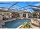 Large screened pool and spa with patio furniture at 17819 Sw 61St Lane Rd, Dunnellon, FL 34432