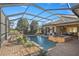 Resort-style pool and spa with covered patio at 17819 Sw 61St Lane Rd, Dunnellon, FL 34432