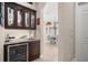 Convenient wet bar with wine cooler and cabinetry at 17819 Sw 61St Lane Rd, Dunnellon, FL 34432