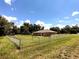 Large backyard with a chain link fence at 21 Maple Crse, Ocklawaha, FL 32179