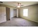Bedroom with carpet flooring and a large closet at 21 Maple Crse, Ocklawaha, FL 32179