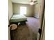 Bright bedroom with a queen-size bed and side table at 21 Maple Crse, Ocklawaha, FL 32179
