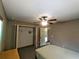 Spacious bedroom with ceiling fan and large closet at 21 Maple Crse, Ocklawaha, FL 32179
