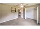 Bedroom with carpet, ceiling fan and closet at 21 Maple Crse, Ocklawaha, FL 32179