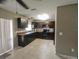 Kitchen with dark cabinets and tile flooring at 21 Maple Crse, Ocklawaha, FL 32179
