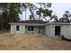 Newly constructed home with gray exterior and a neatly landscaped yard at 232 Locust Pass, Ocala, FL 34472