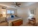 Bedroom with queen bed, nightstands, and ceiling fan at 3031 Se 5Th Ter # C, Ocala, FL 34471
