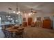 Bright dining area with wood table and chairs near kitchen at 3031 Se 5Th Ter # C, Ocala, FL 34471