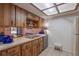Kitchen with wood cabinets, double sink, and breakfast bar at 3031 Se 5Th Ter # C, Ocala, FL 34471