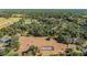 Aerial view showing tennis court and surrounding neighborhood at 3590 Sw 24Th Avenue Rd, Ocala, FL 34471