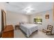 Cozy bedroom with a double bed and ceiling fan at 3590 Sw 24Th Avenue Rd, Ocala, FL 34471
