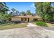 Ranch style home with brick accents and a landscaped yard at 3590 Sw 24Th Avenue Rd, Ocala, FL 34471